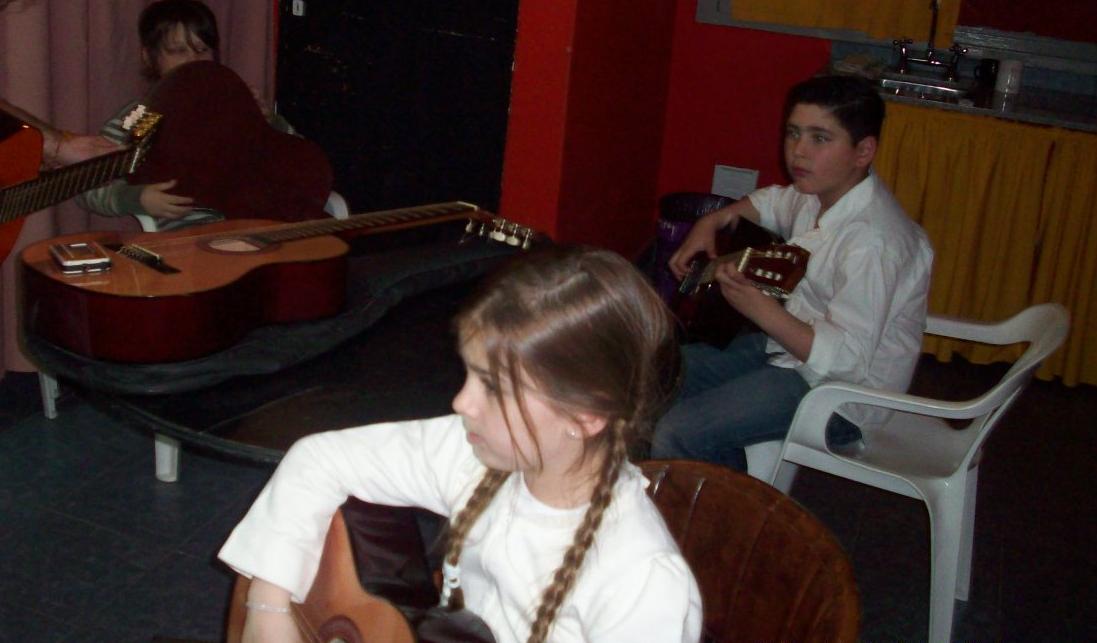 Lepeley Foundation boy girl playing guitars